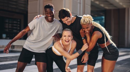 Group of runners having fun after outdoor training